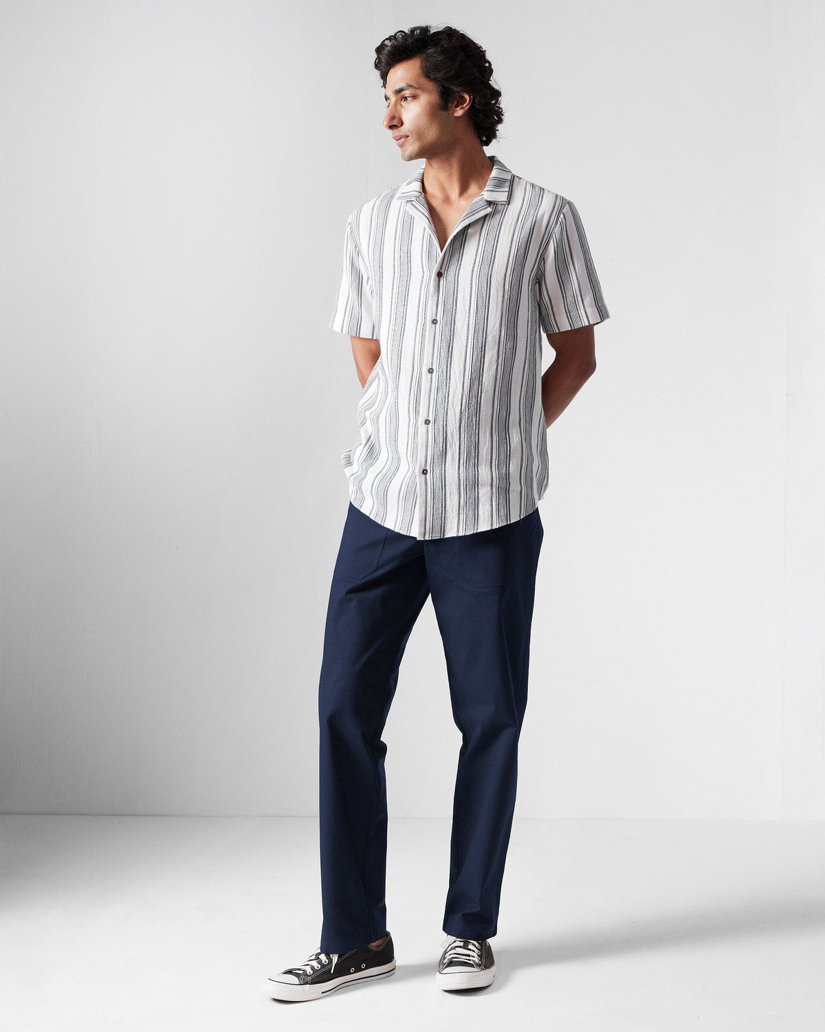 Full-length view of navy Zar Pants worn by a person.