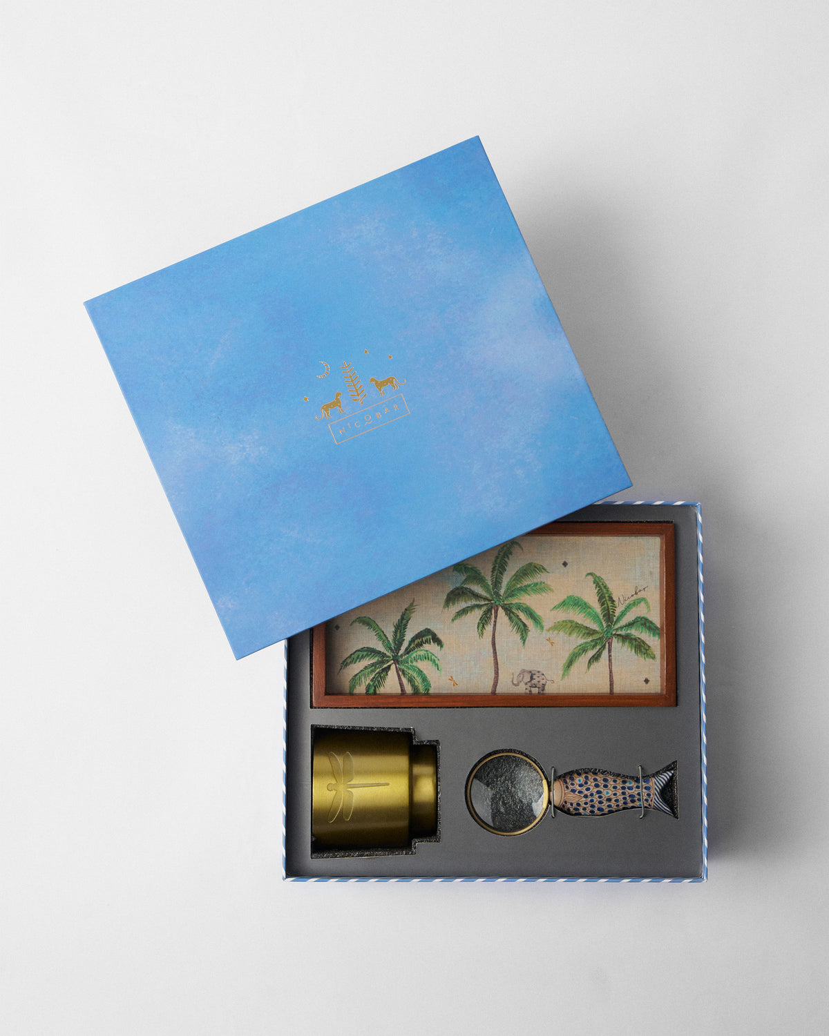 Explorer gift set packed in a blue box with tray and magnifier.