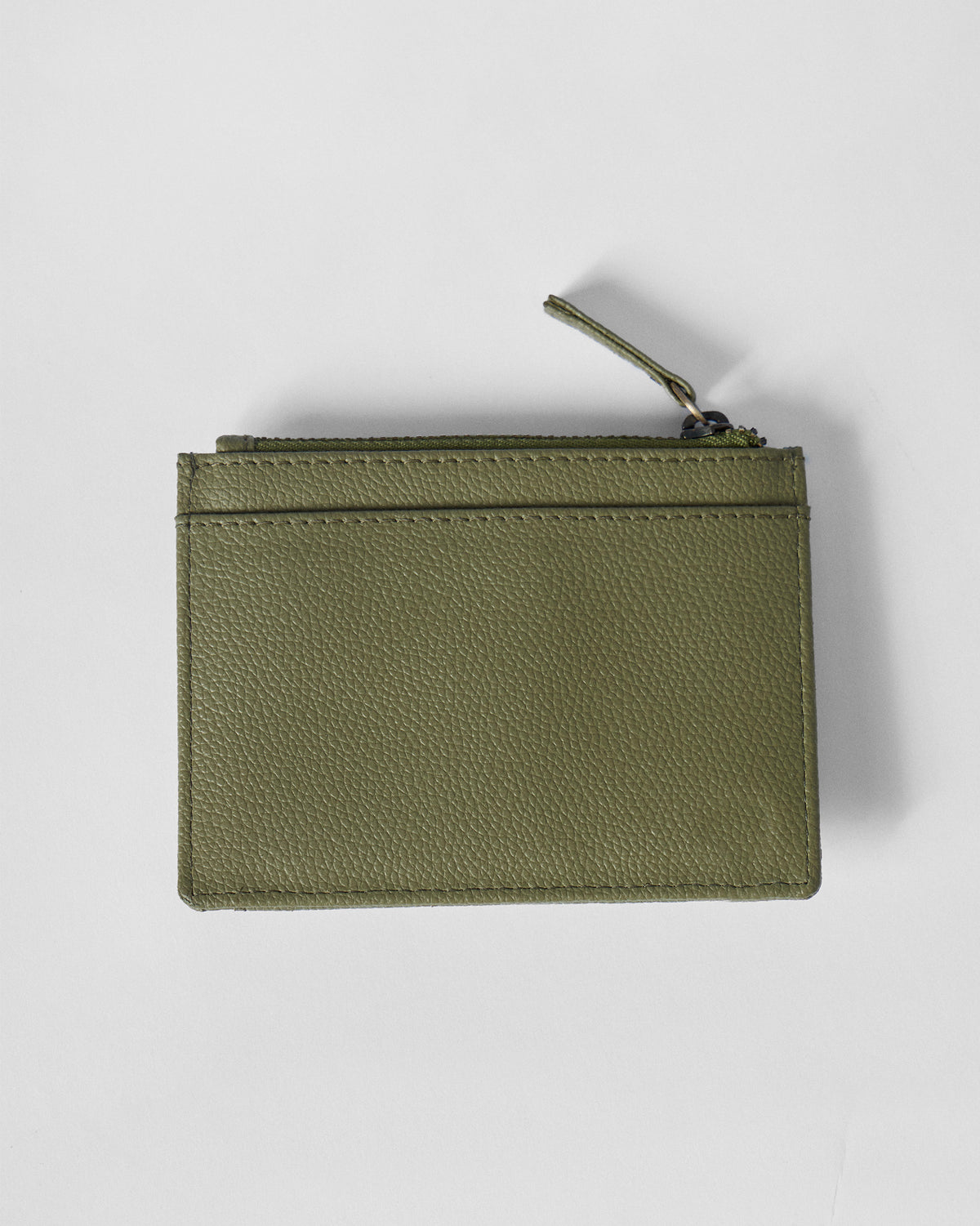 Green Everyday Star card holder with a zippered top and front slot.