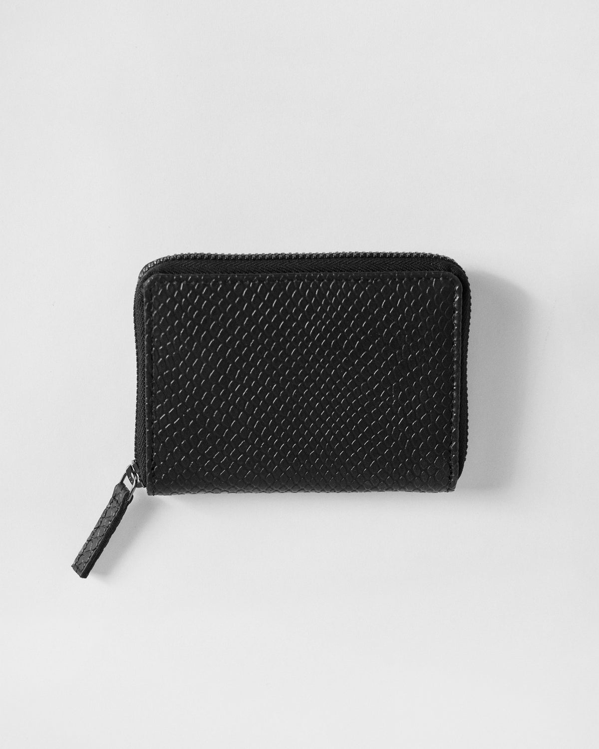 Black textured All Rounder Wallet with zip closure laid flat.