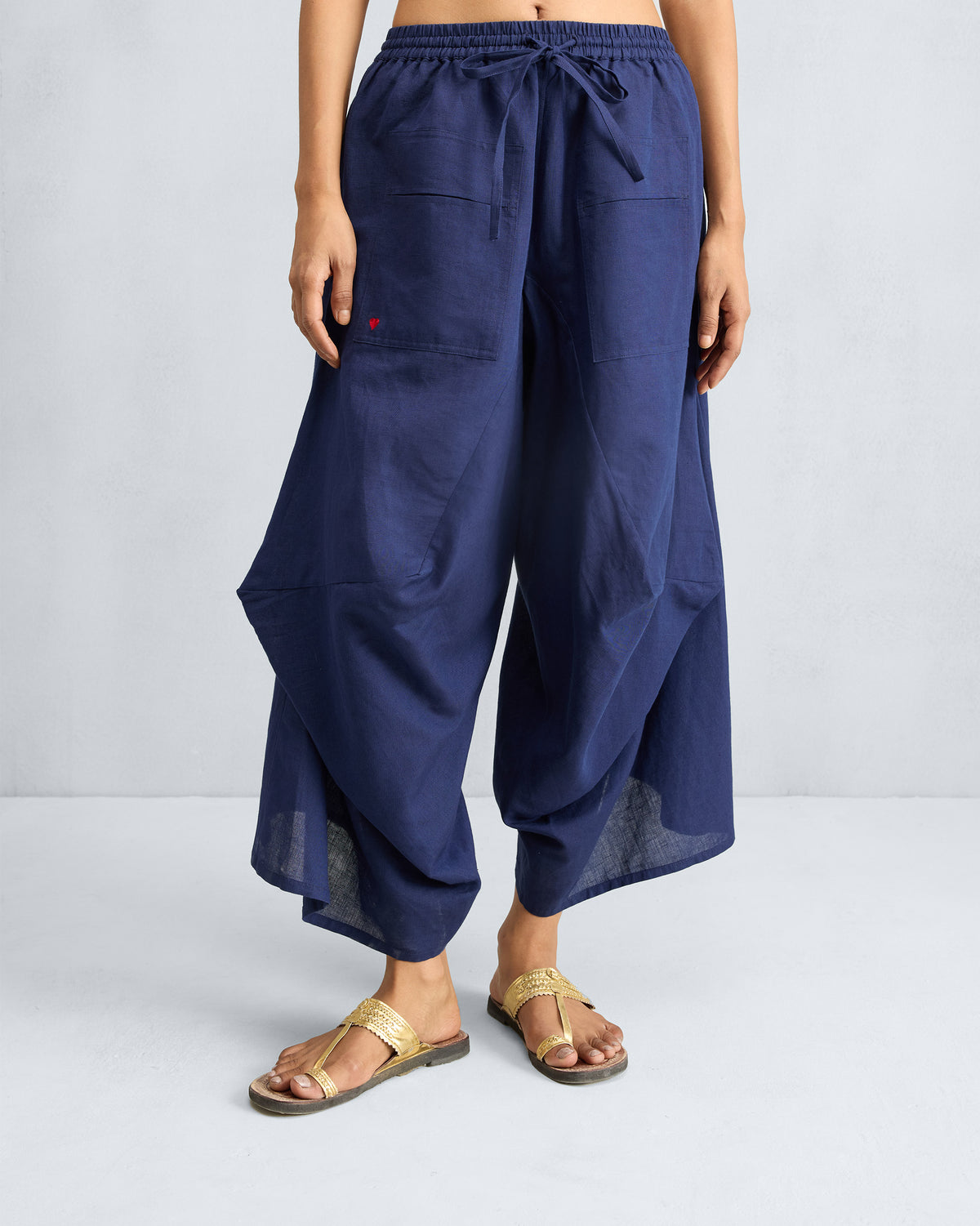 Ink blue Yoka Trousers with a flared silhouette.
