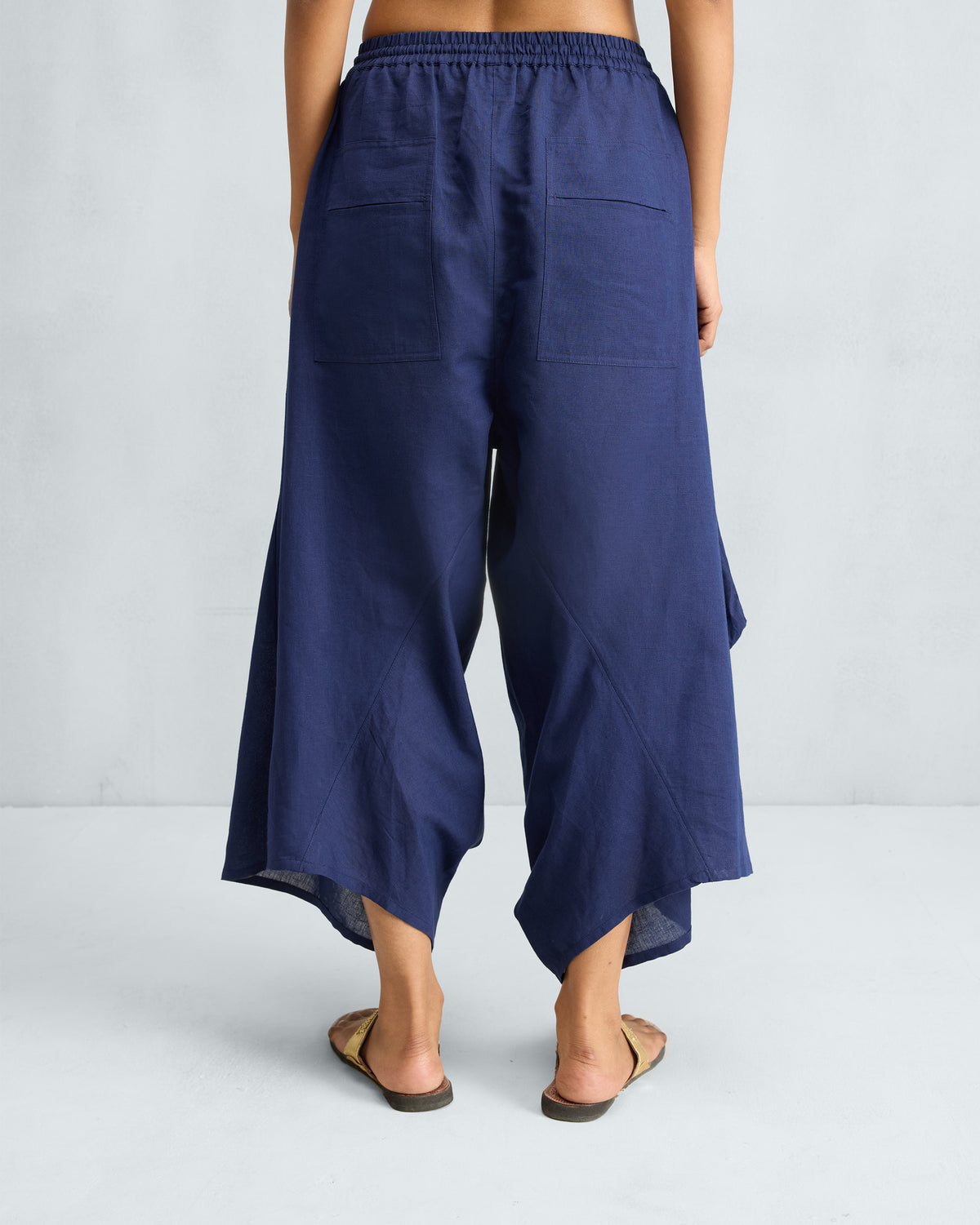 Back of ink blue Yoka Trousers with patch pockets.