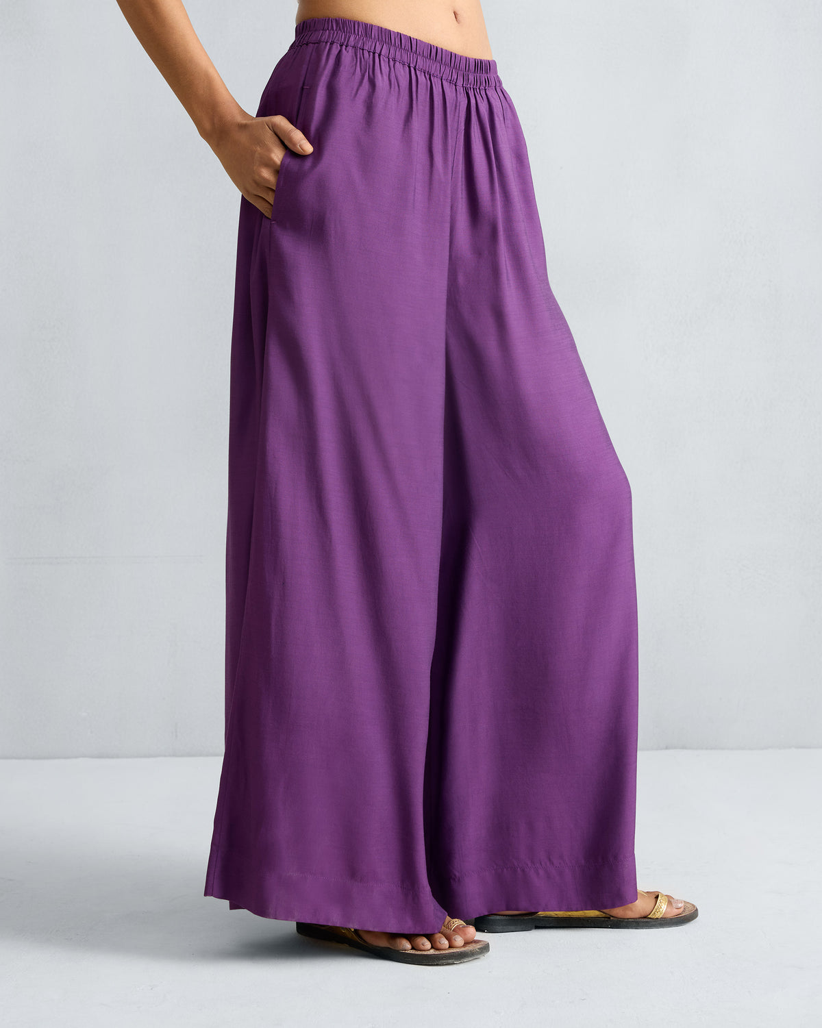 Person wearing purple Classic Pyjama pants showing a voluminous wide-leg drape.