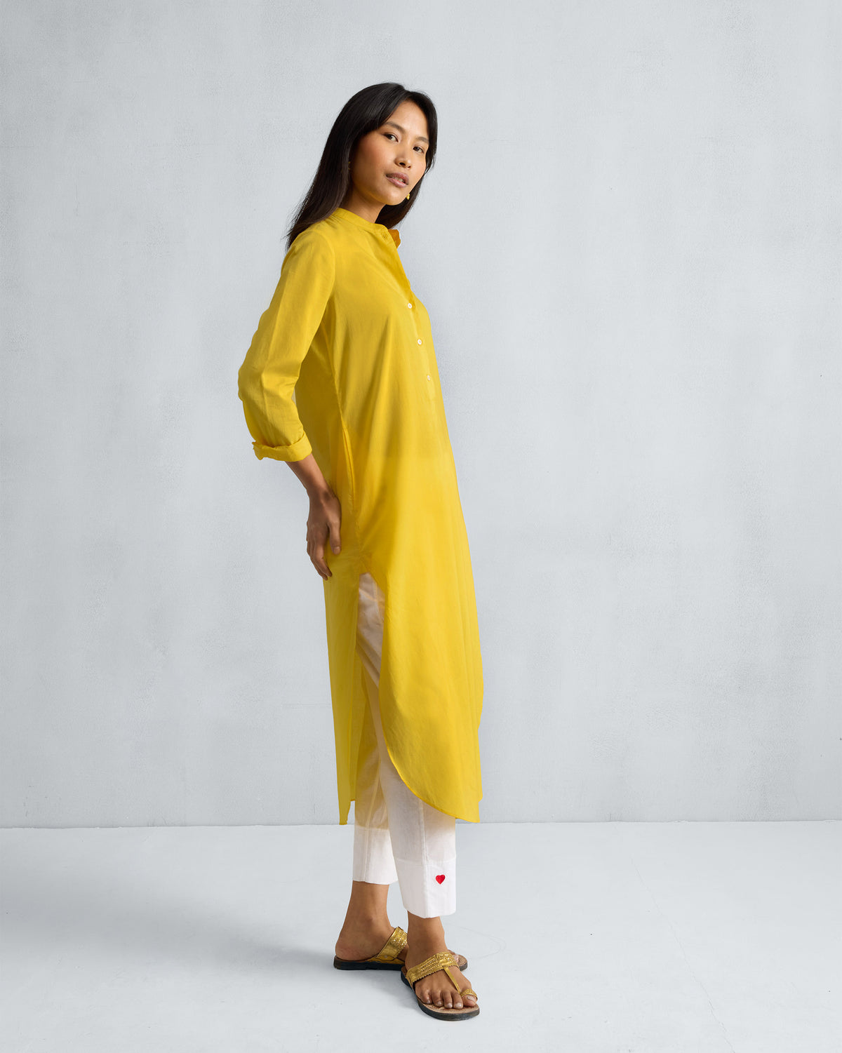 Side view of a yellow Basic Long Kurta showing the side slits.