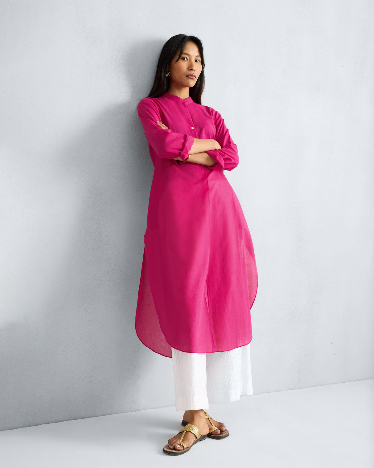 Person wearing a fuchsia Basic Long Kurta with a curved high-low hem.