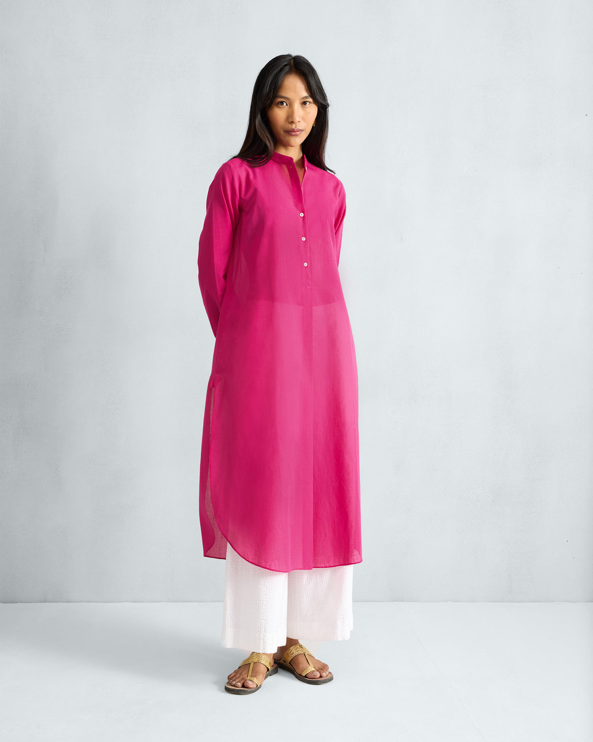 Person wearing a full-length fuchsia Basic Long Kurta.