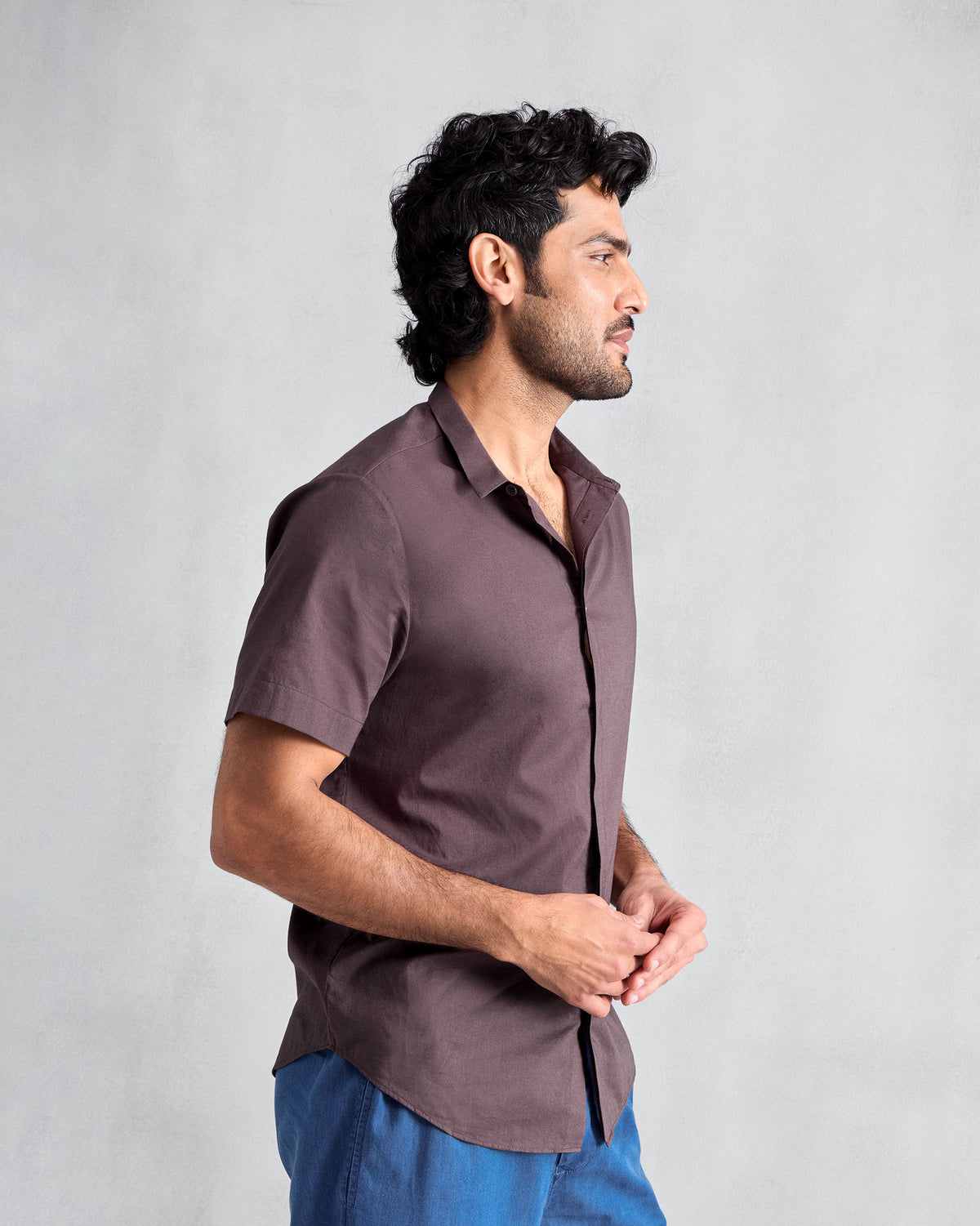 Side view of a chocolate plum Riverine shirt.