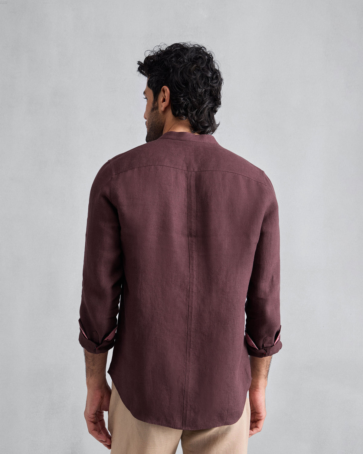 Back of a chocolate plum Nawab Shirt with a Nehru collar and centre back seam.