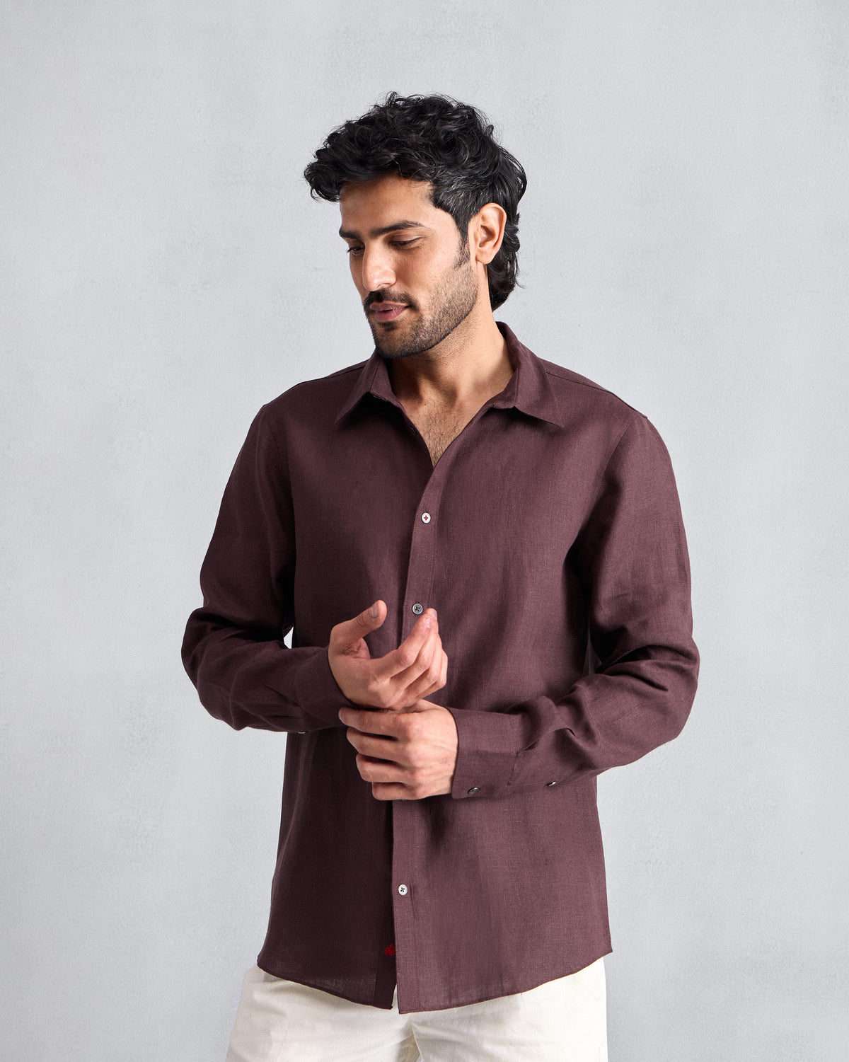 Person wearing a chocolate plum Classic shirt.