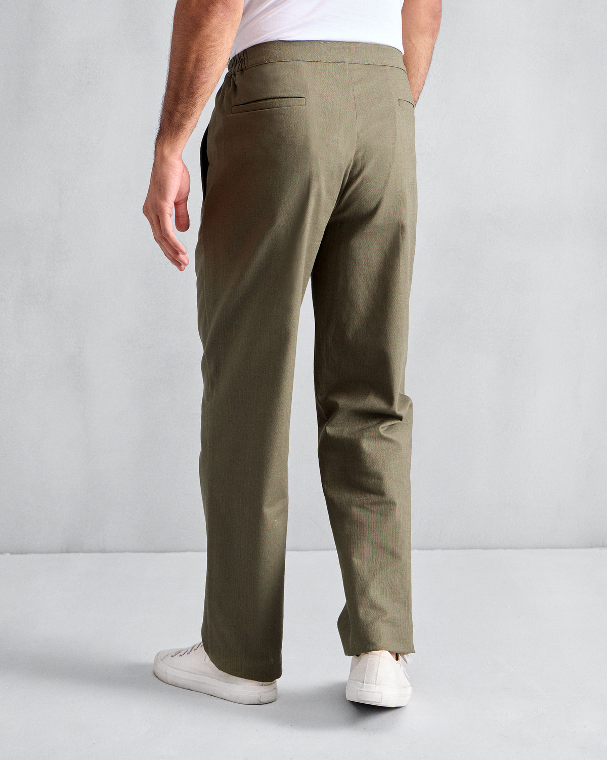 Back of olive Meadow Pants with welt pockets.