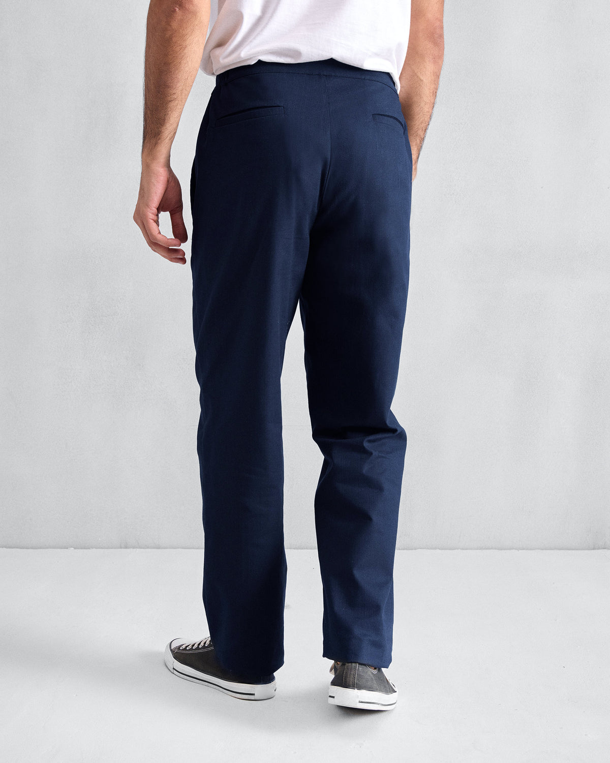 Back of orian blue Meadow Pants with welt pockets.