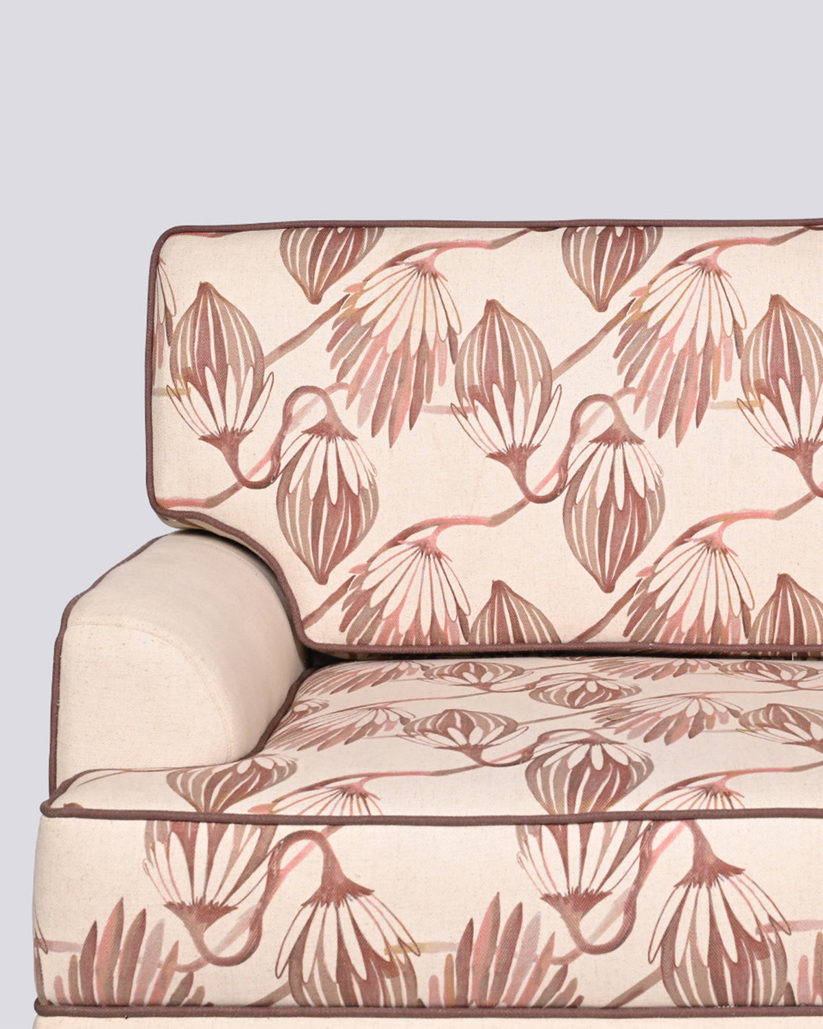 Close-up of terracotta botanical print on the Field Sofa cushions.