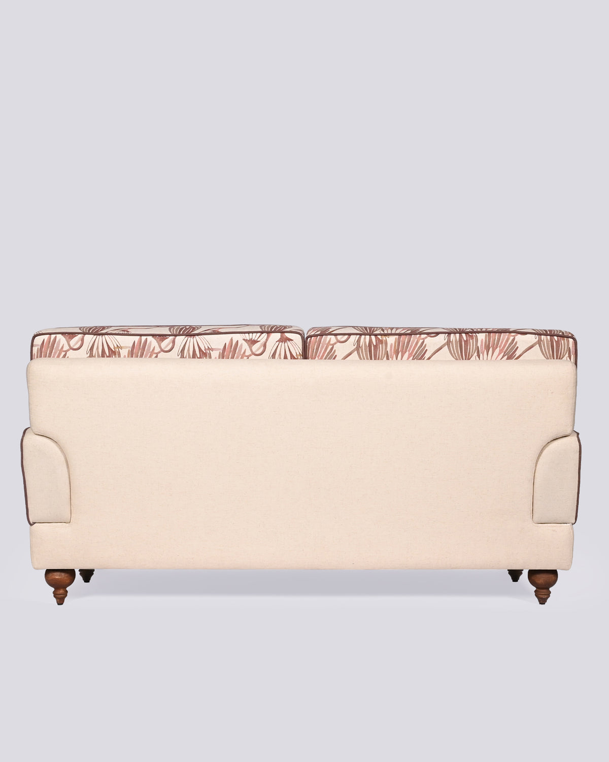Back of the Field Sofa in cream upholstery with patterned cushion tops.