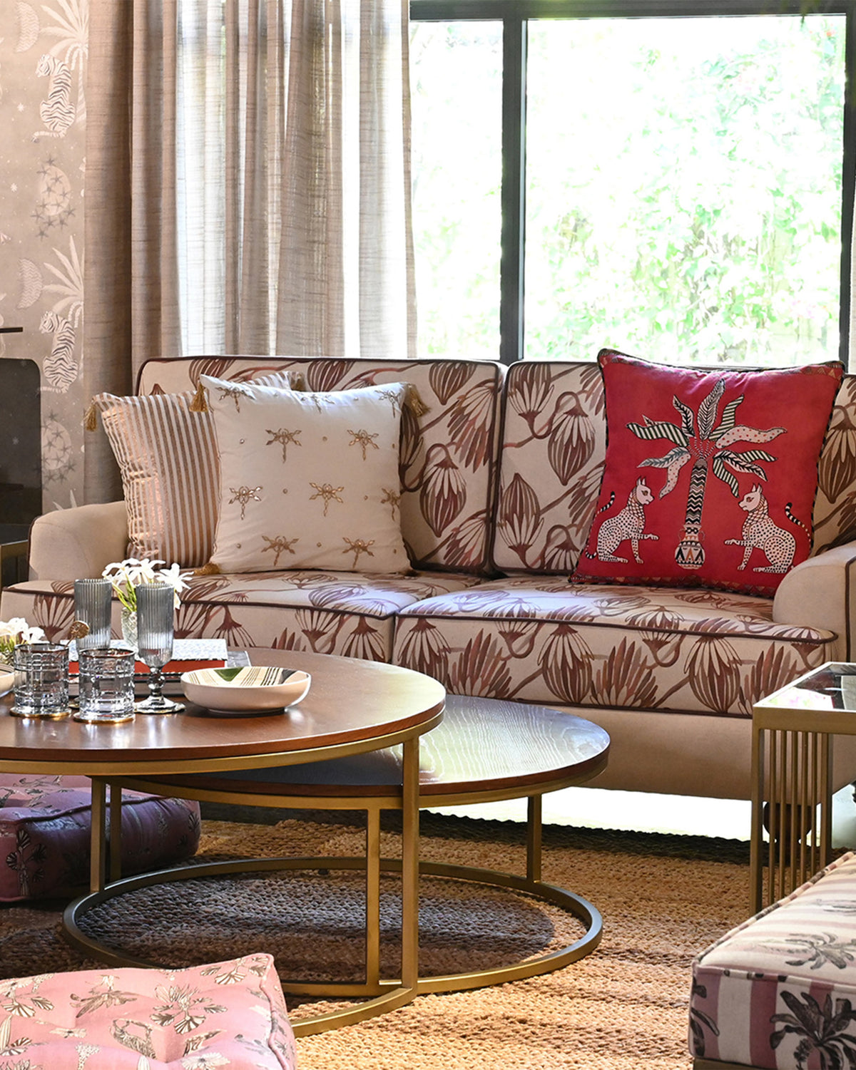 Field Sofa with botanical print by a window with nesting coffee tables.