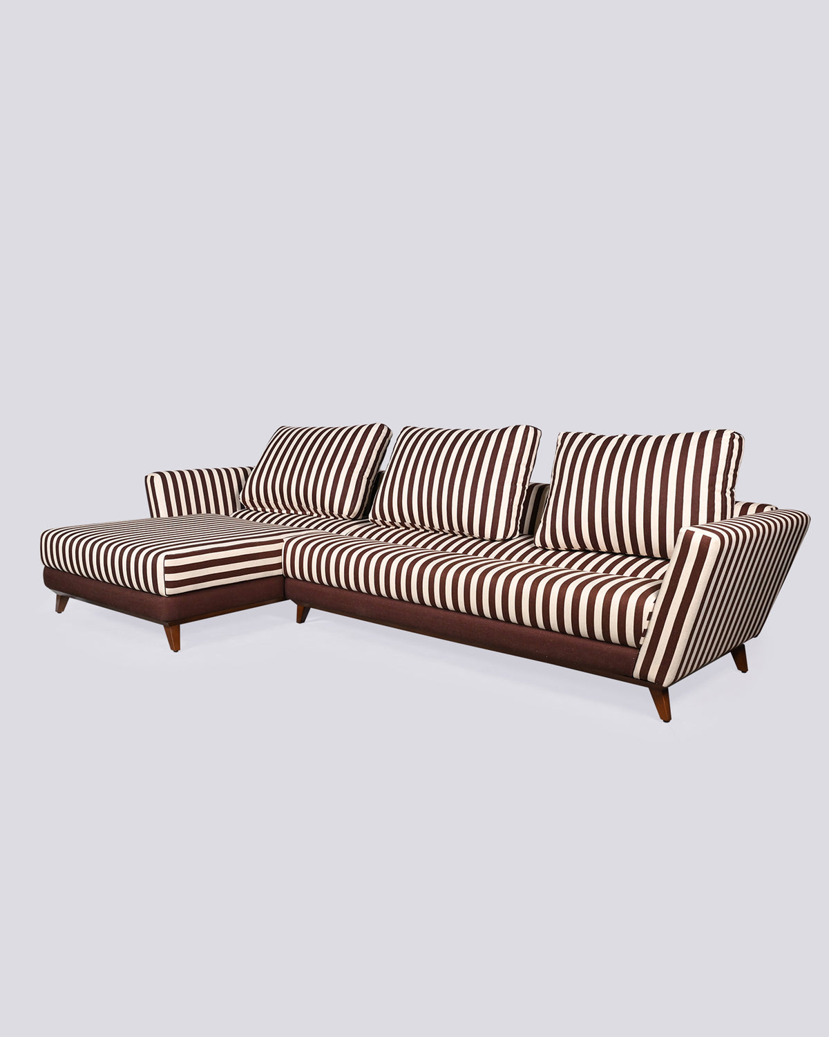Three-quarter view of the striped Vale sofa sectional showing the chaise depth.