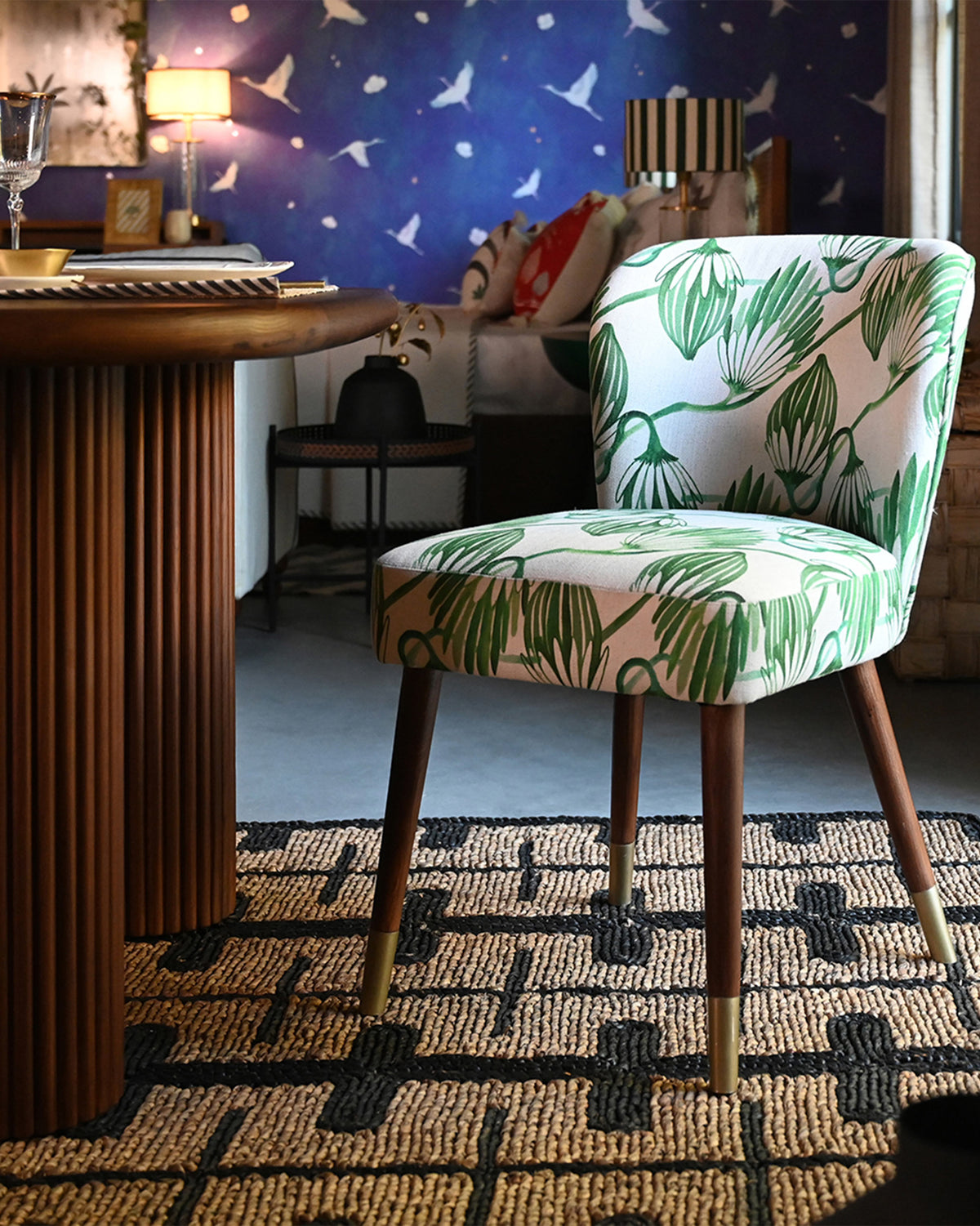 Breeze Dining Chair with green blooms print at a round dining table.