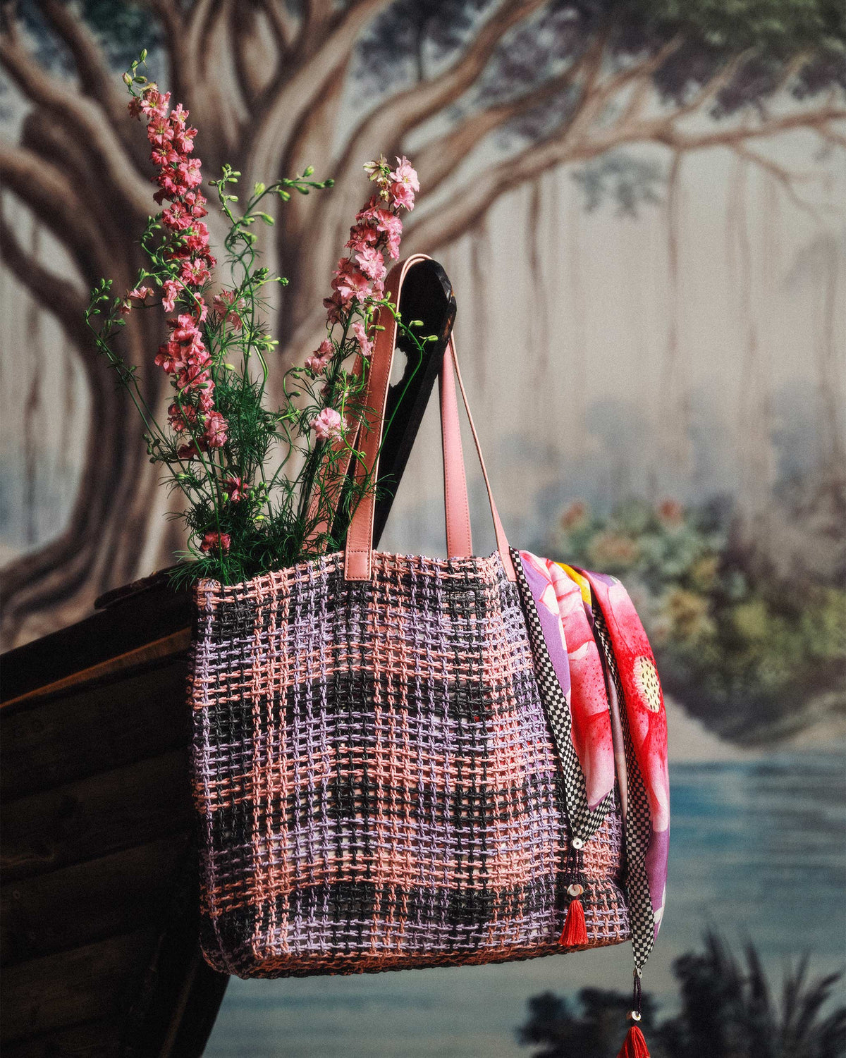 Raffle woven tote in pink, lilac and charcoal check with pink leather handles.