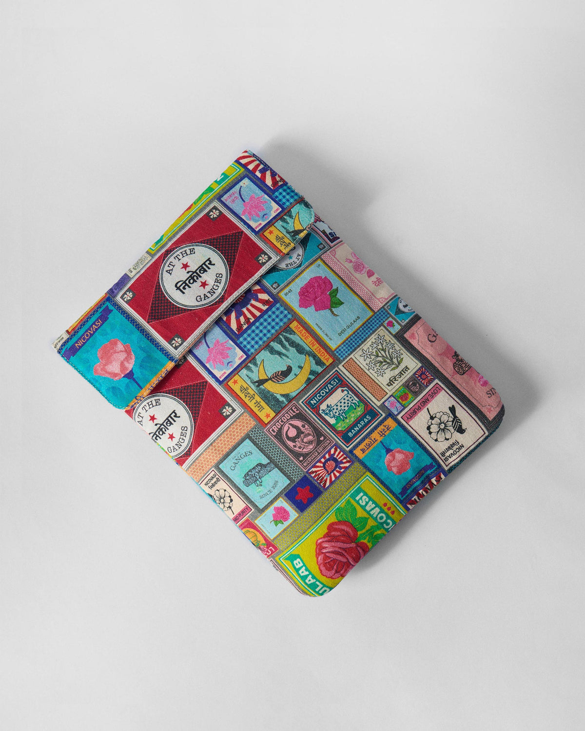 Matchbox Laptop Sleeve laid flat showing colourful matchbox labels.