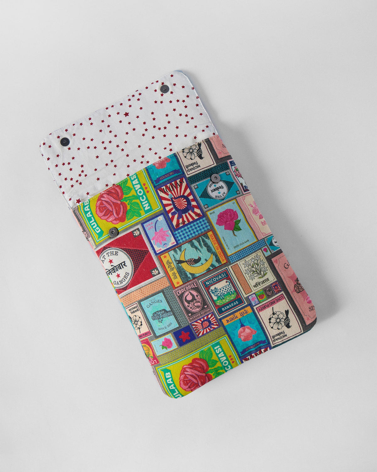 Open Matchbox Laptop Sleeve with matchbox print and star lining.