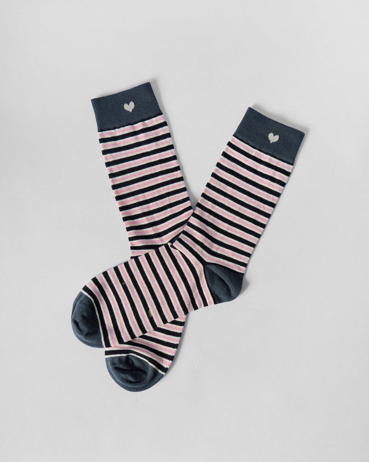 Pair of Candy Stripe socks laid at an angle, showing heel and toe.