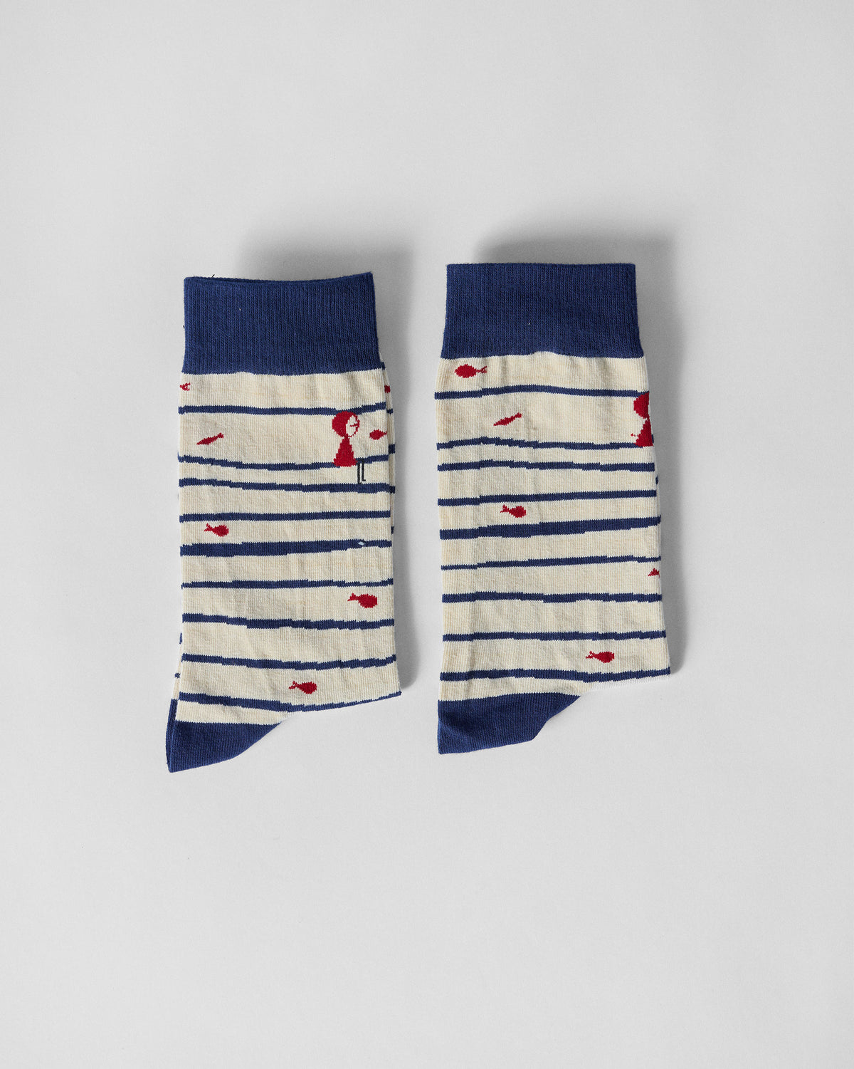 Pair of Go Fish socks side by side, with navy cuffs and navy toes.