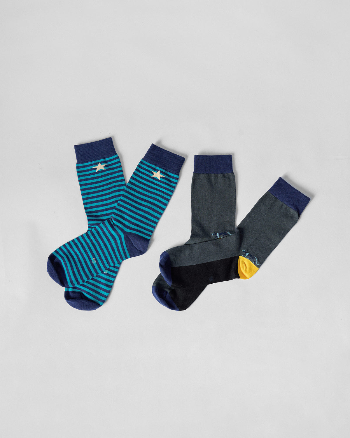 Men's Stride Socks showing teal stripes and charcoal yellow-heel pairs.