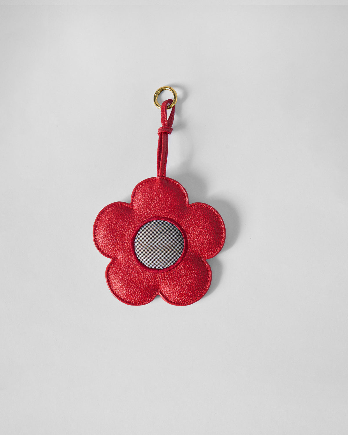 Red Flower Coin Pouch with a gingham centre, hanging from a loop.