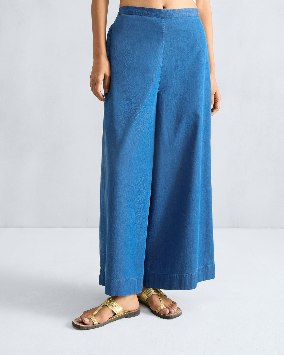 Person wearing denim blue Basic pyjamas with a wide A-line flare.