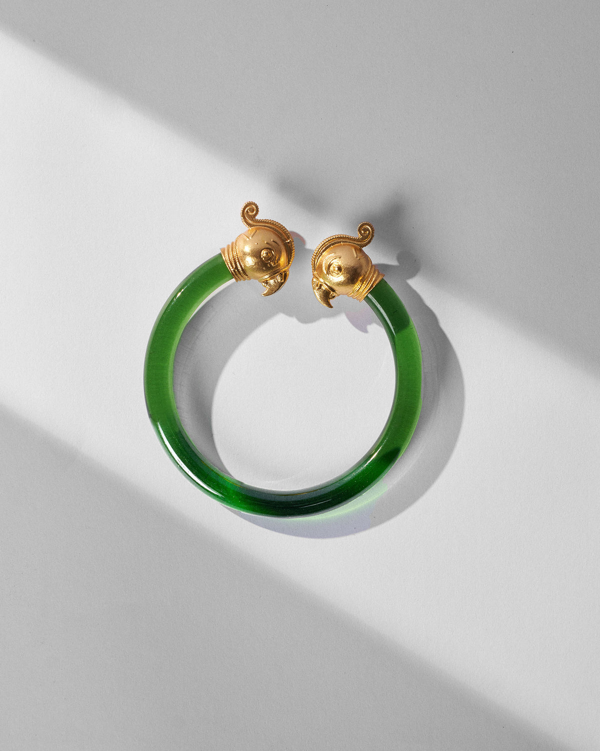 Green Mithu bangle with gold parrot-head ends.