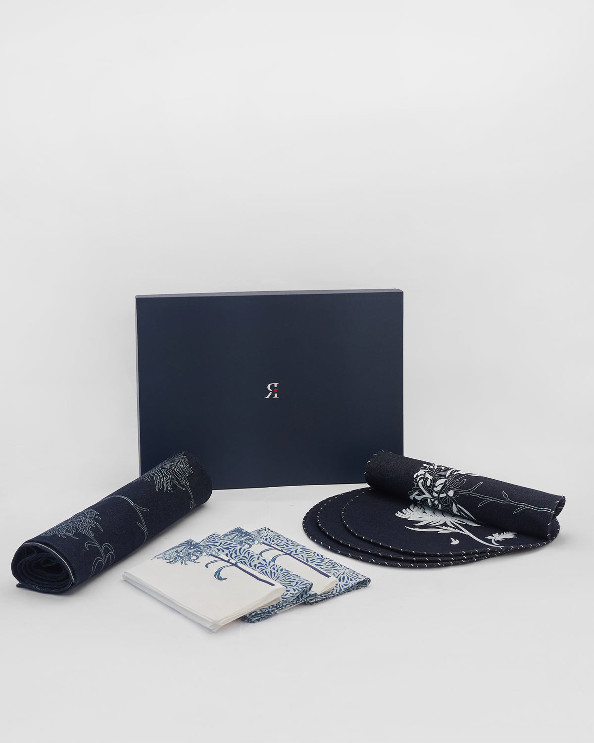 Chandramallika Table Gift Set with navy box, runner, napkins, and placemats.