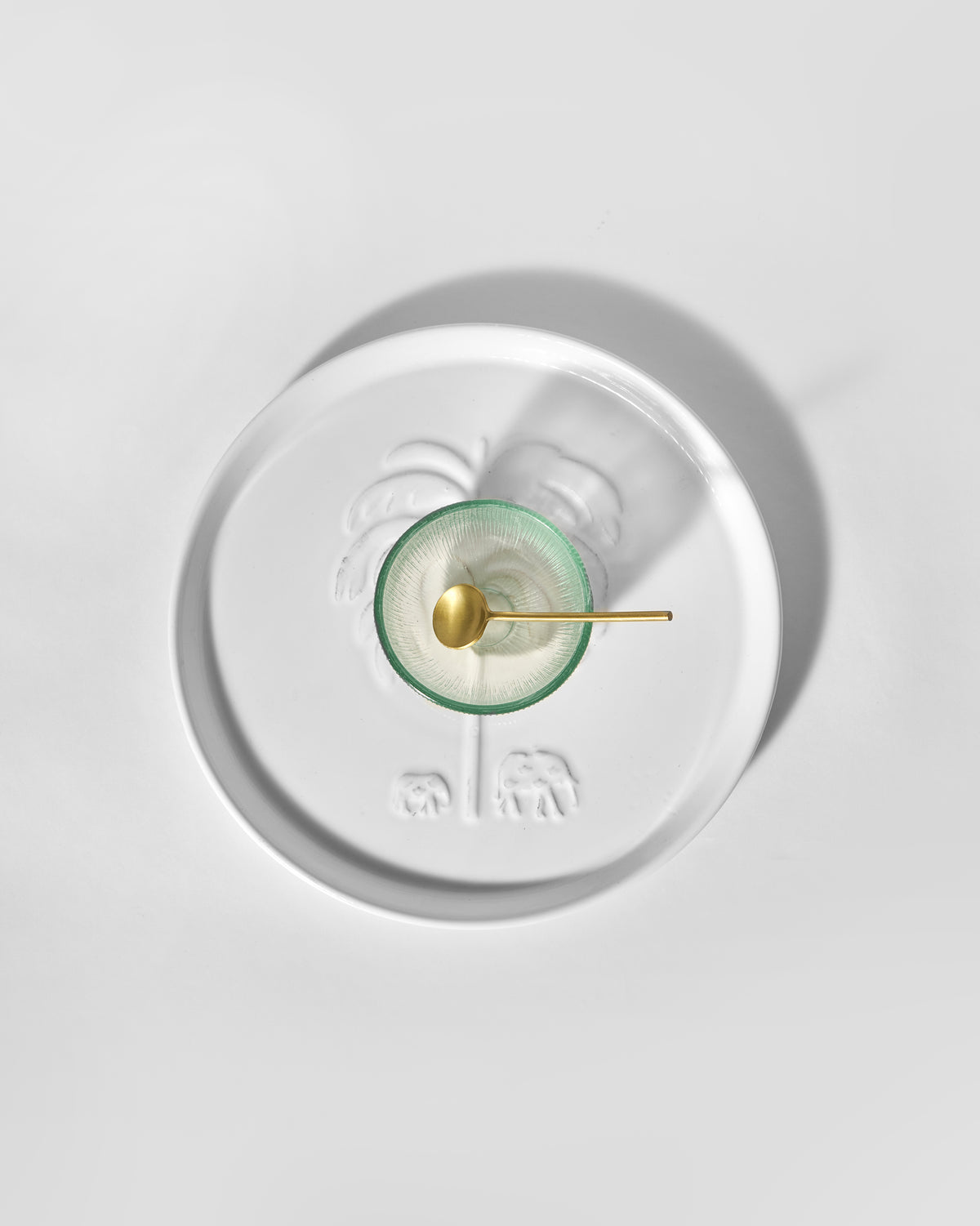 Ele Palm Chip & Dip Platter seen from above, with a green glass bowl and gold spoon.