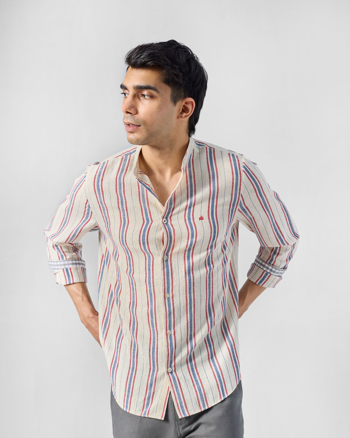 Nawab Shirt front view in ivory with red and blue vertical stripes.