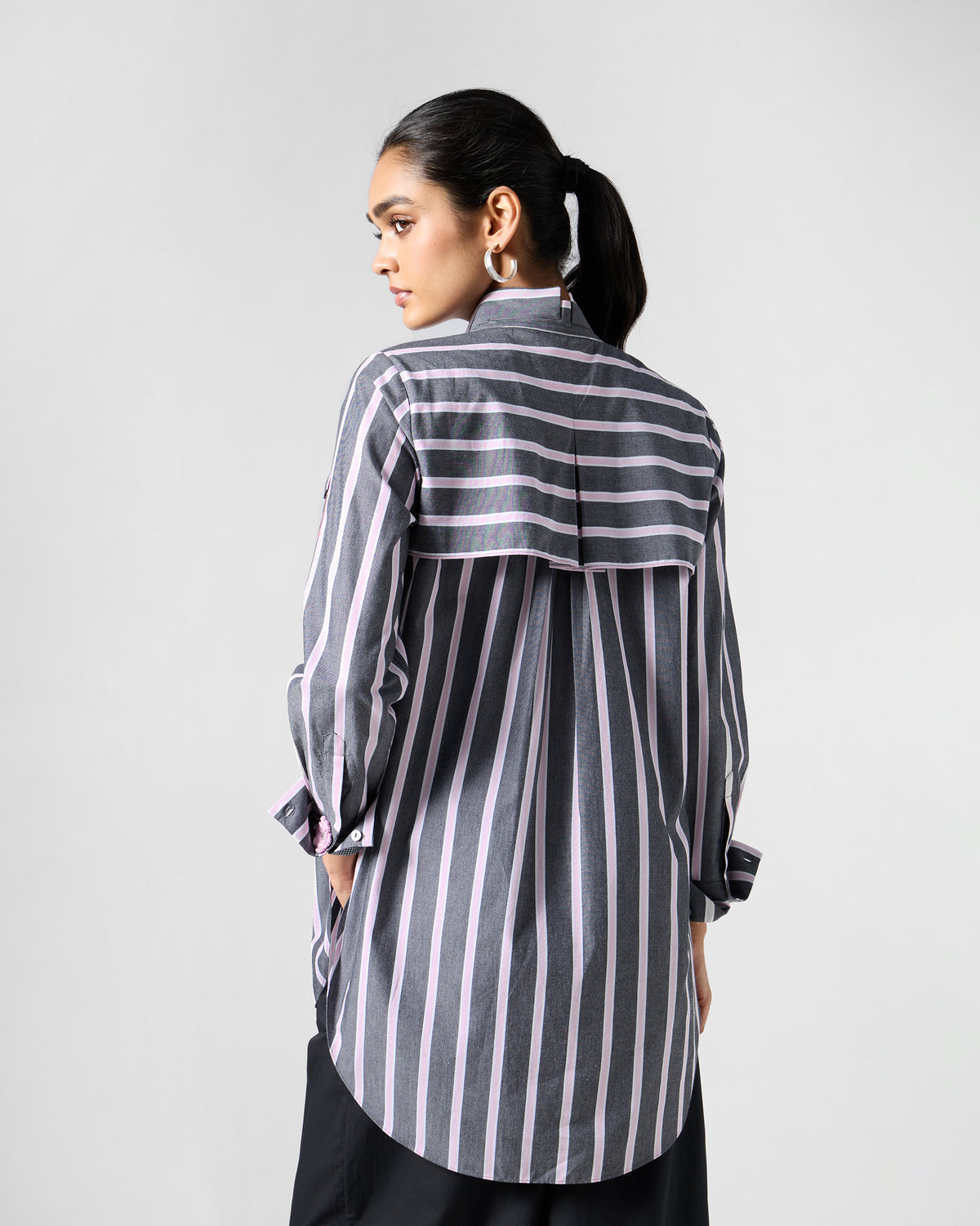 Back of a charcoal and pink striped Trench shirt with a horizontal yoke.