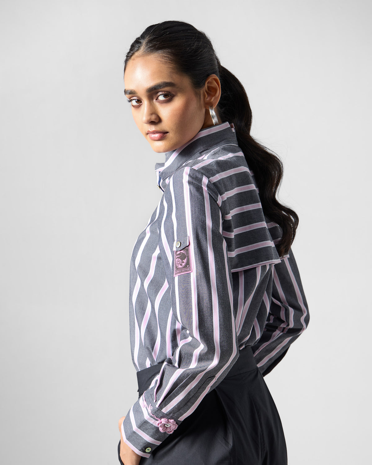 Back of a charcoal and pink striped Trench shirt showing the yoke and sleeve details.