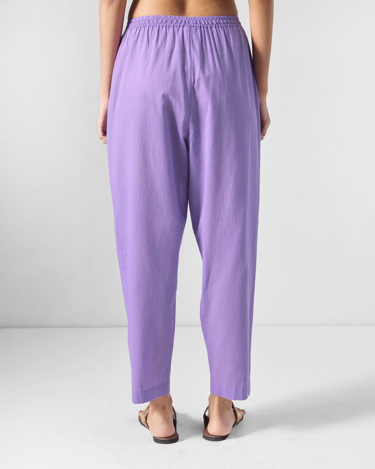 Back of lilac Kinatra Pants with a gathered elastic waistband.