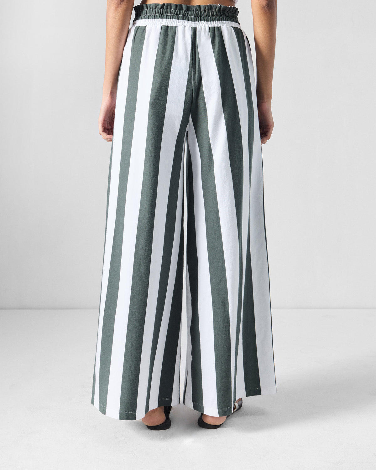 Back of charcoal and white striped Nova pants with an elasticated paperbag waist.