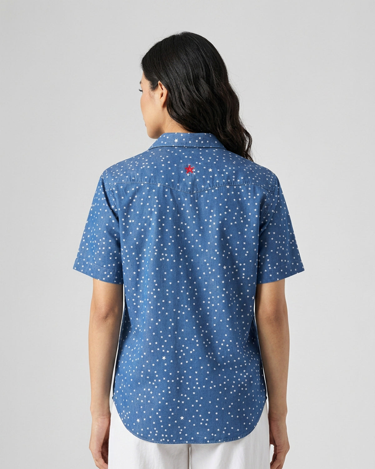 Back of a denim Spark shirt with a red star on the yoke.