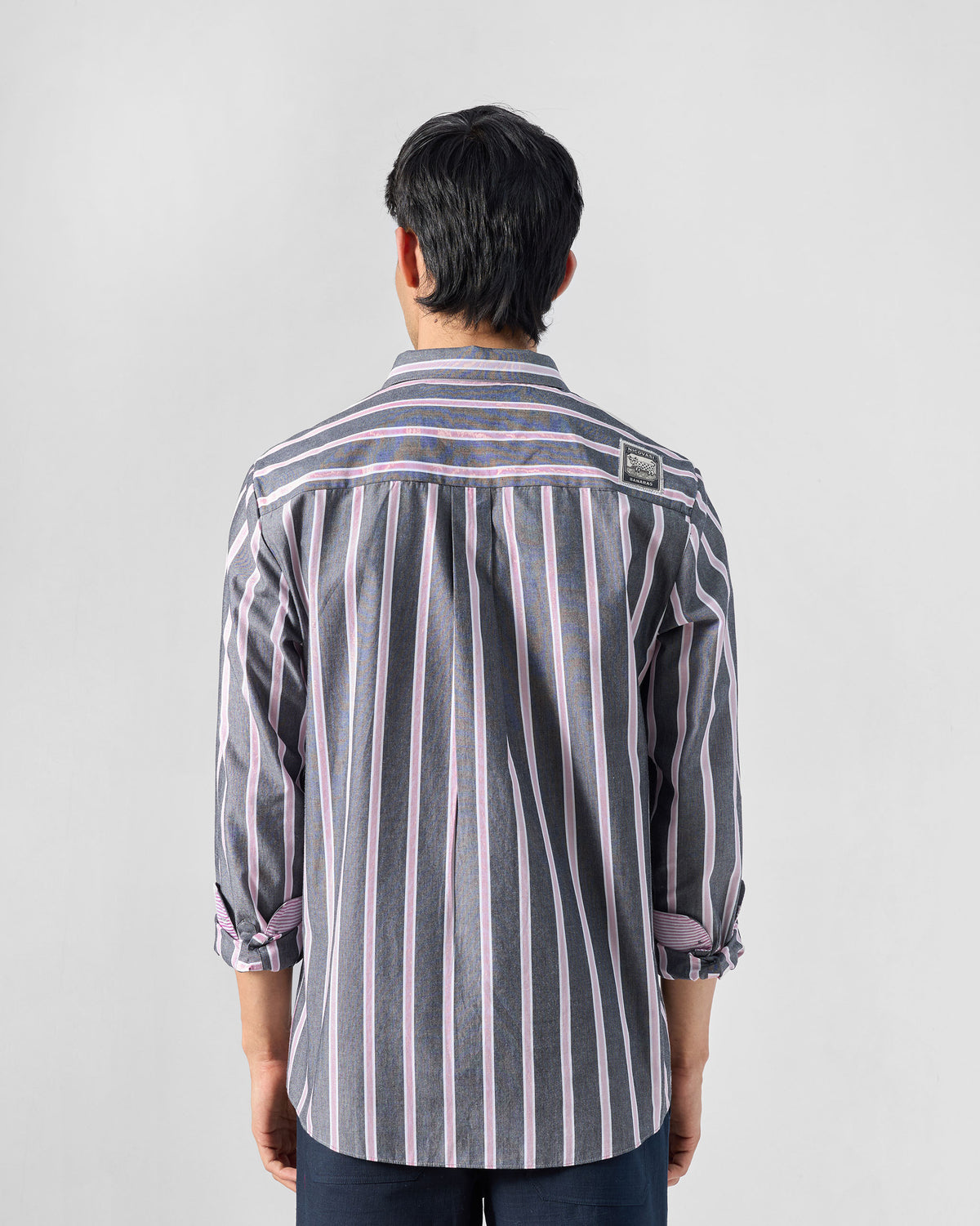 Back of a charcoal and pink striped Classic shirt with a box pleat.