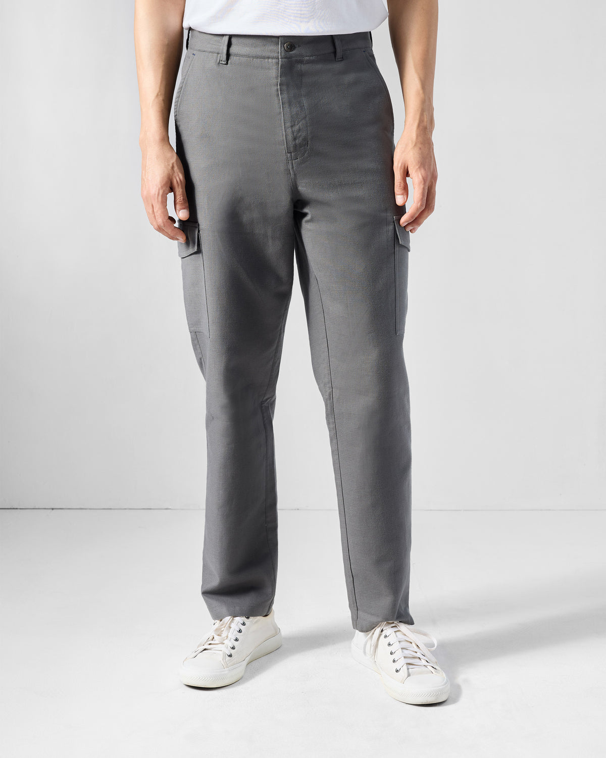 Charcoal Riverbank pants with cargo pockets worn straight-leg.