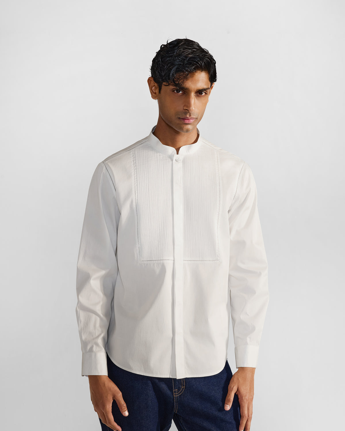 Person wearing a white Badger shirt with a pleated bib.
