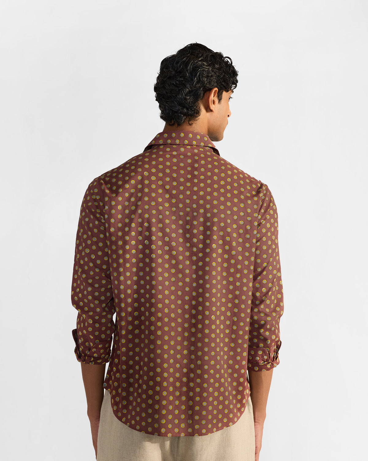 Back of a brown Pipit Shirt with an all-over circular block print.