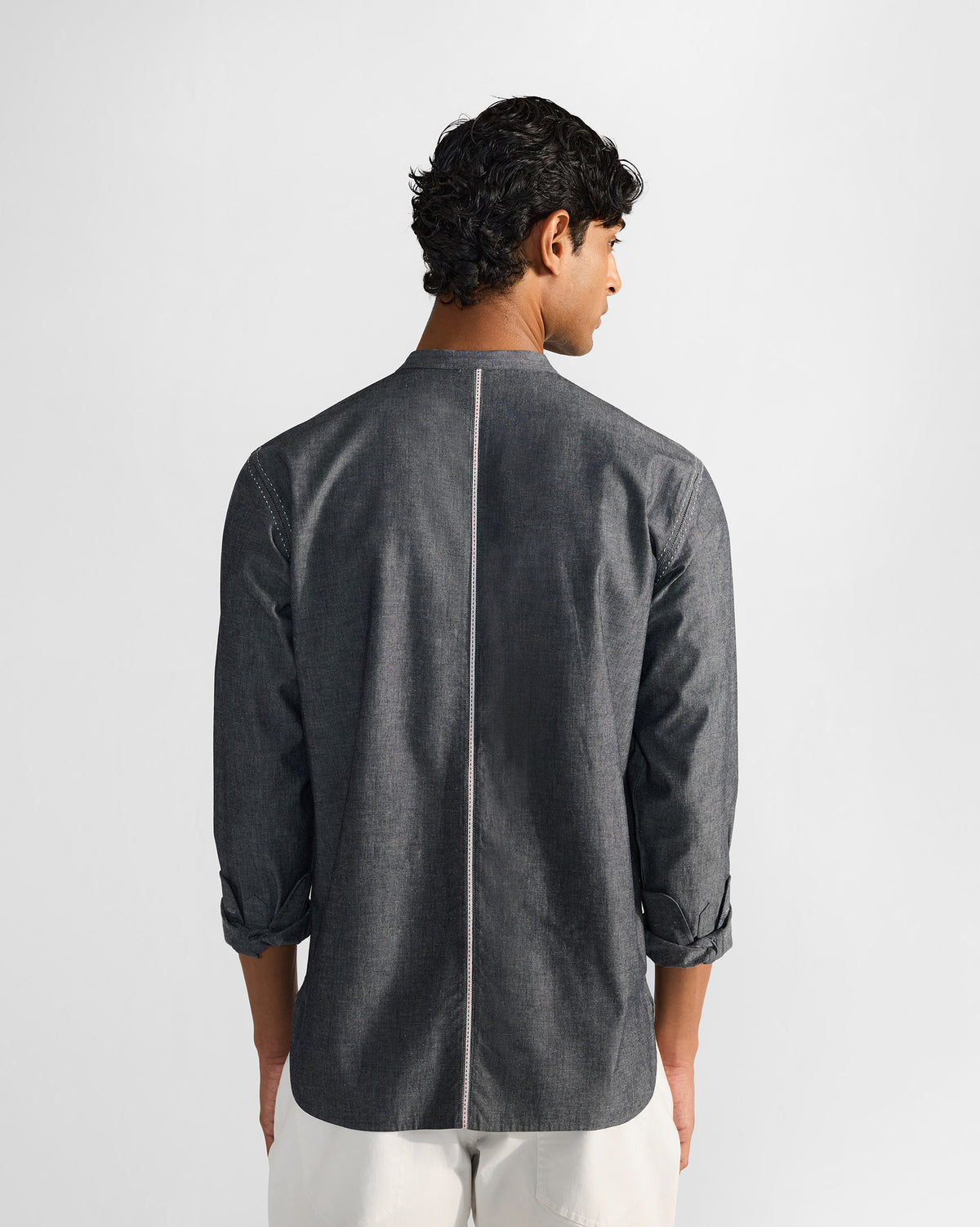 Back of a charcoal Marten shirt with a white center stripe.