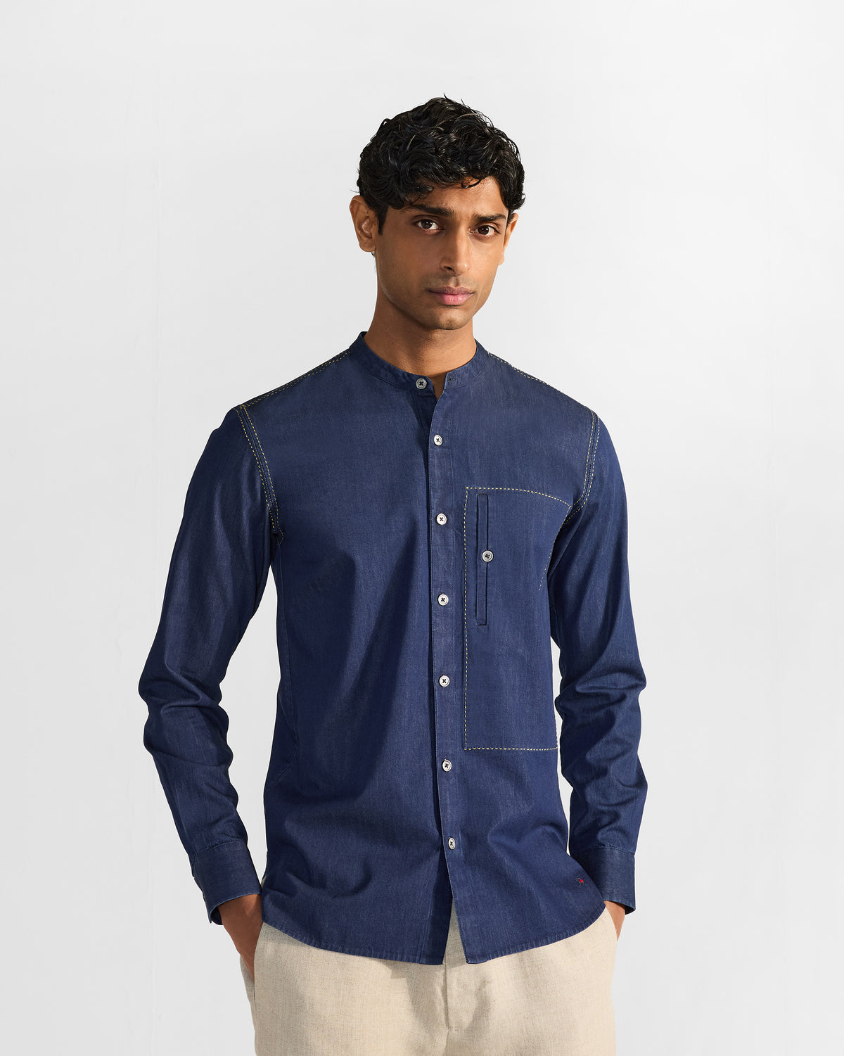 Person wearing an indigo Loris shirt with a mandarin collar.