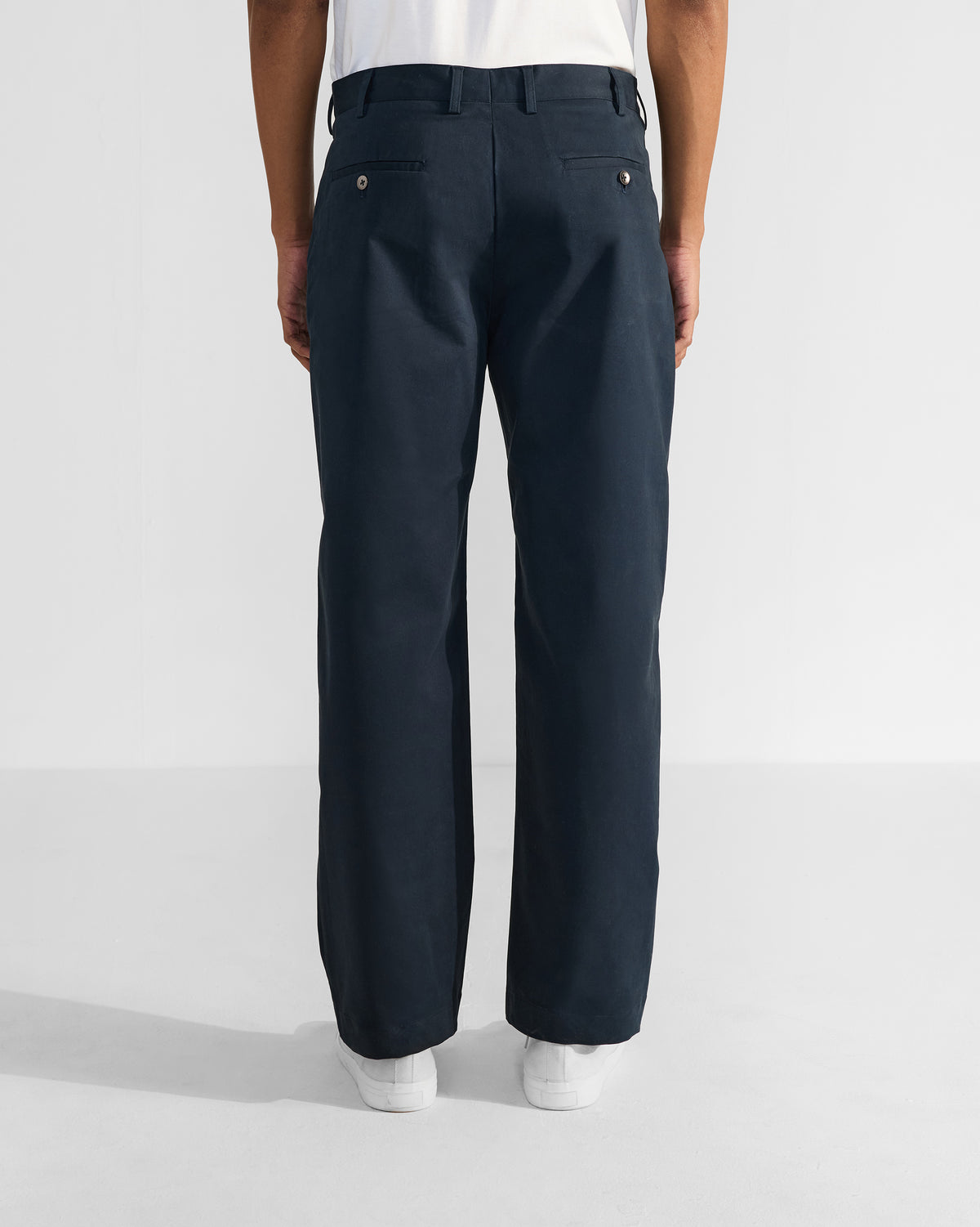 Back of navy Flycatcher Trousers with buttoned welt pockets.