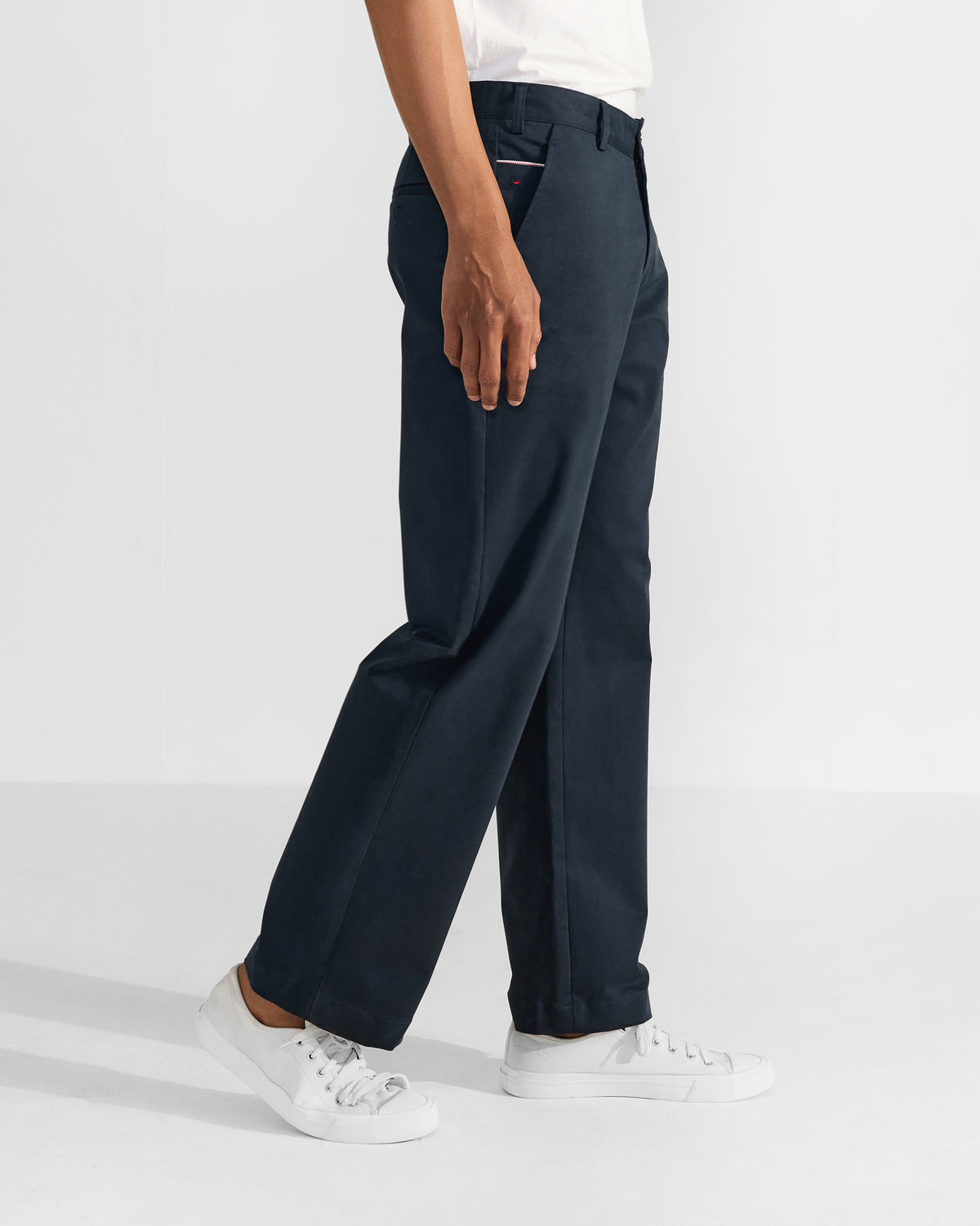 Side view of navy Flycatcher Trousers with a straight-leg drape.