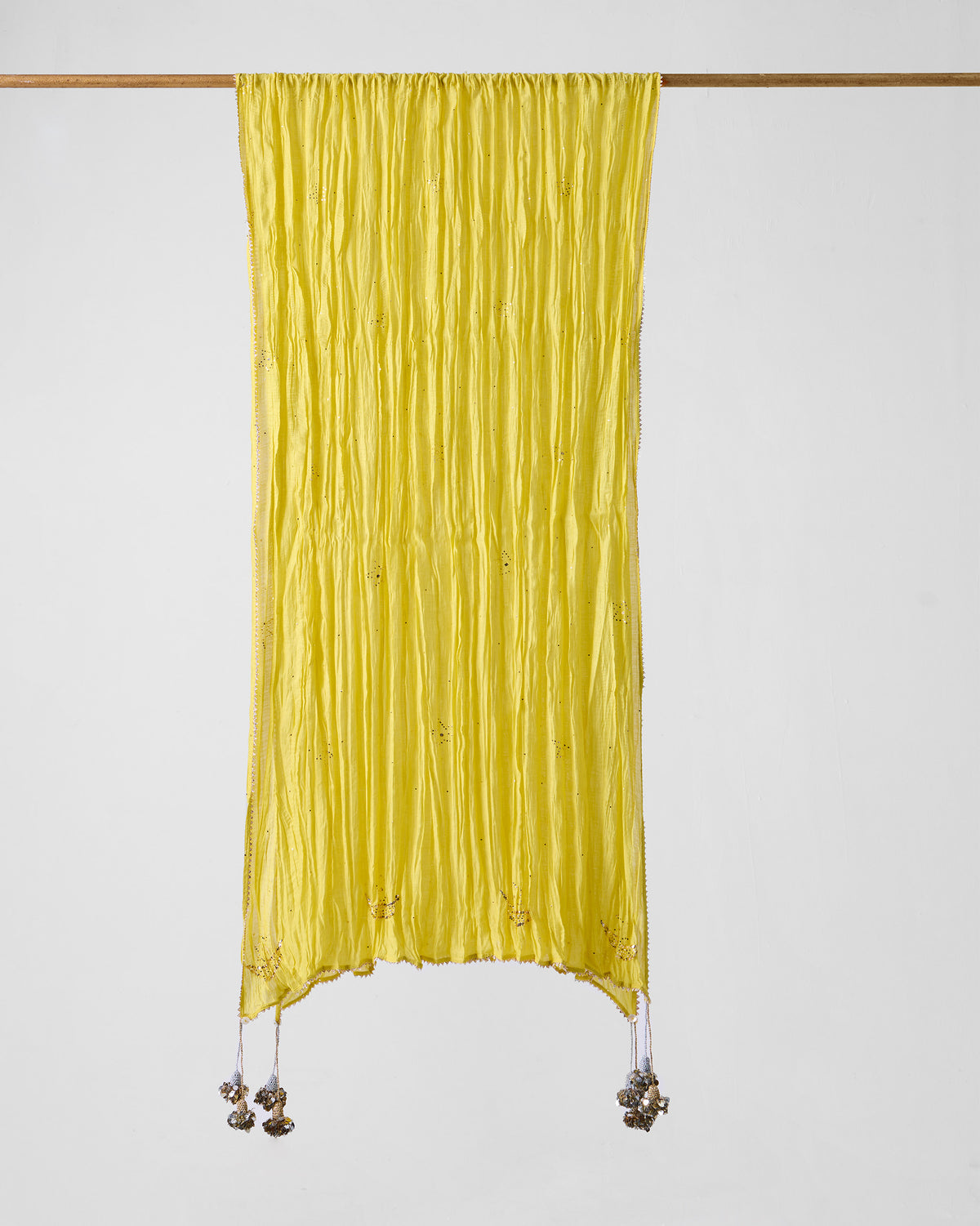 Yellow embroidered Shanti dupatta hanging full length with corner tassels.