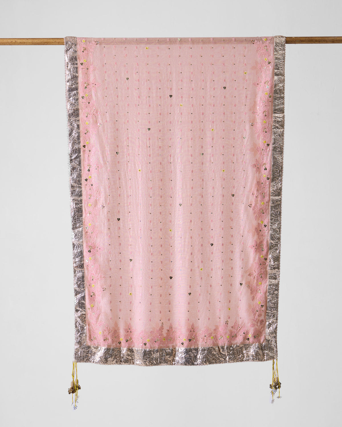 Dust pink embroidered Lila dupatta with a silver border and corner tassels.