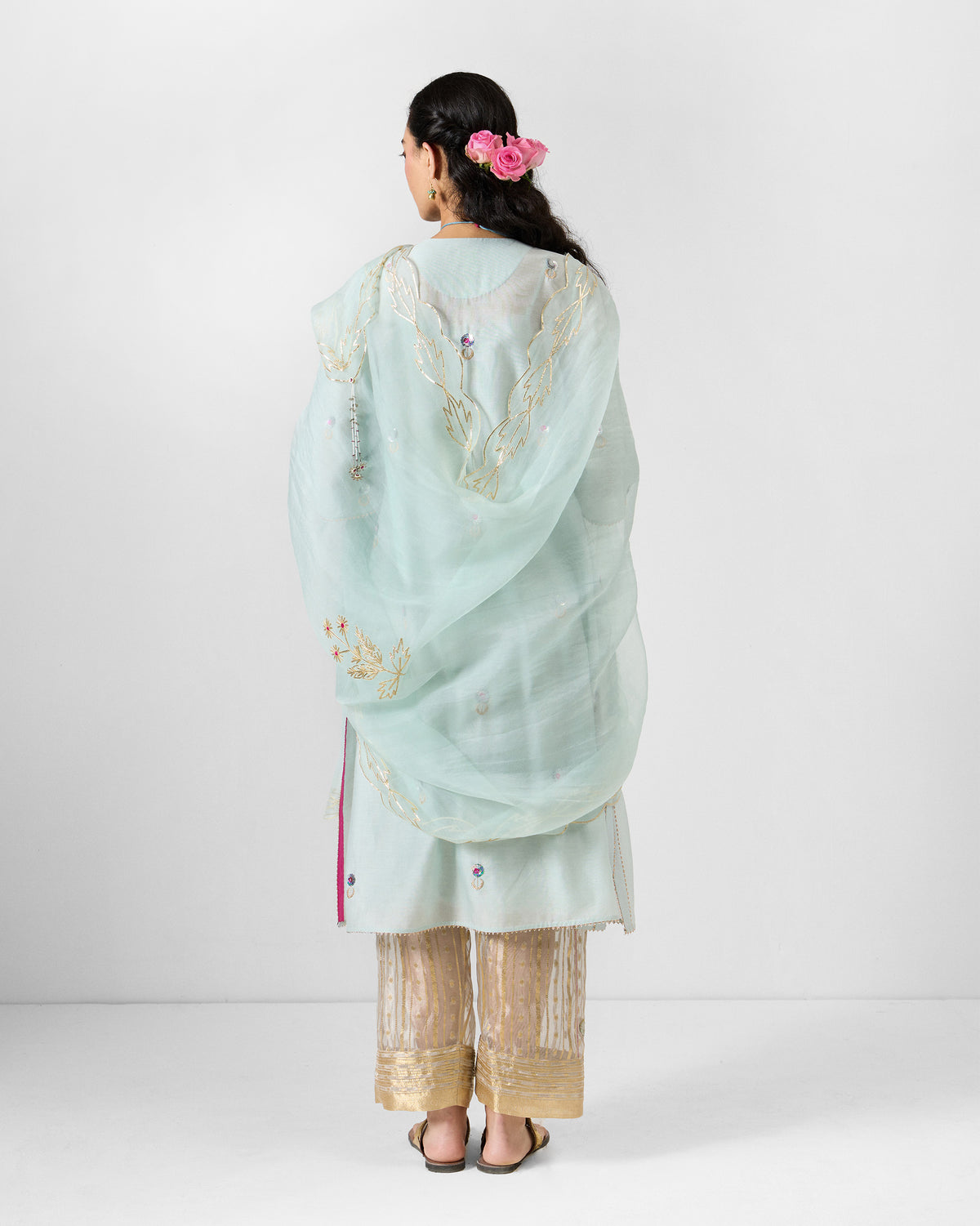 Back of a powder blue Kasara Dupatta with gold gota embroidery.