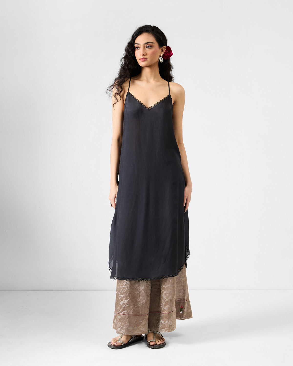 Black lace-trimmed slip worn with the charcoal Amboli Kaftan.