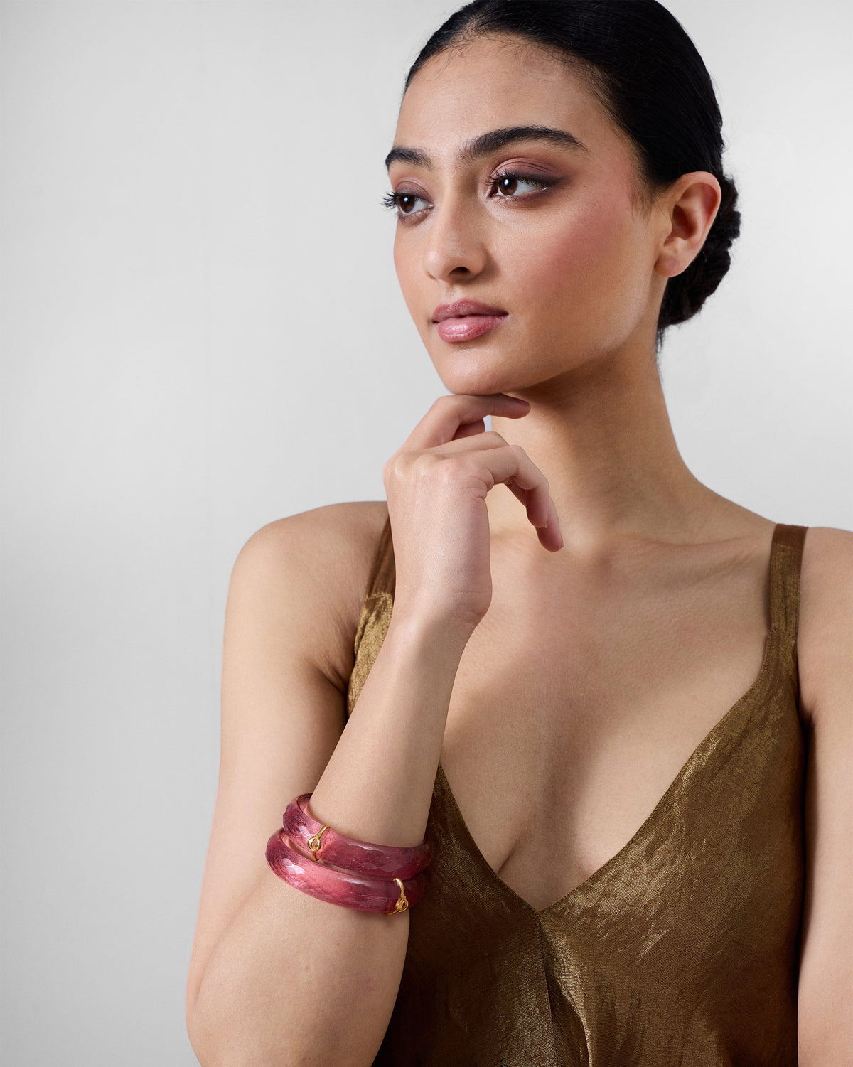 Person wearing Shaan Bangles stacked on one wrist.